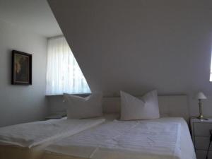 Krevet ili kreveti u jedinici u objektu Appartement in Bad Malente-Gremsmühlen mit Grill und Garten