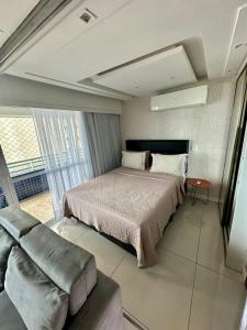 Tempat tidur dalam kamar di Apartamento Vista Mar