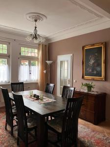 a dining room with a table and chairs at Castrum Visum Wernigerode in Wernigerode
