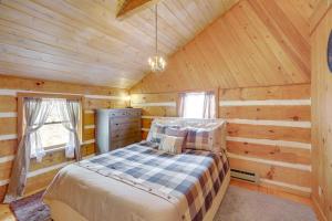 a bedroom with a bed in a wooden cabin at Ashe County Log Cabin Mountain-View Deck, Sauna in Creston