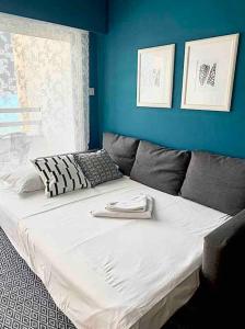 Ένα ή περισσότερα κρεβάτια σε δωμάτιο στο Emma Sea View Suite