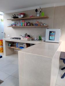 A kitchen or kitchenette at HABITACIONES EN casa de playa