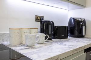 Kaffe- og tefaciliteter på WestPoint Luxury Apartment