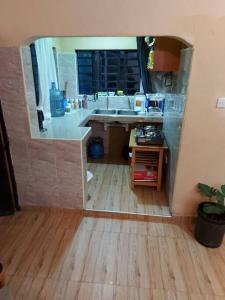 a kitchen with a sink and a counter top at The Orange Cottage in Nyeri