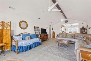 a living room with a couch and a table at Lucky Enough in Gulf Shores