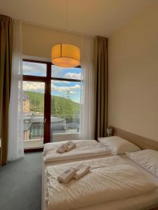 Voodi või voodid majutusasutuse Hotelový apartmán ALFRED D405 toas +47 fotot