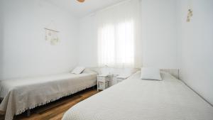Postel nebo postele na pokoji v ubytování Casa Uly 2
