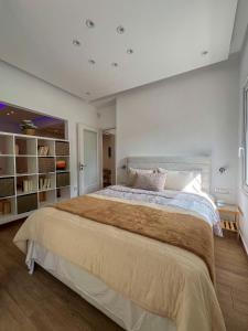 a large bedroom with a large bed in it at Raise Varkiza Serenity Suite in Vari