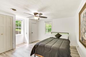 a bedroom with a bed and a ceiling fan at Seneca Vacation Rental with Grill Near Lake Hartwell in Seneca