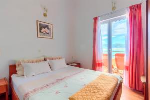 Postel nebo postele na pokoji v ubytování VILLA JELA