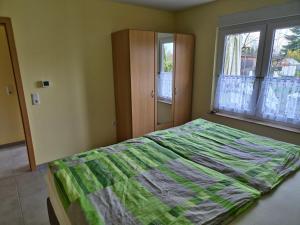 Ένα ή περισσότερα κρεβάτια σε δωμάτιο στο Ferienhaus SIGGI