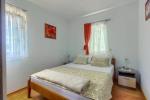 Postel nebo postele na pokoji v ubytování VILLA JELA