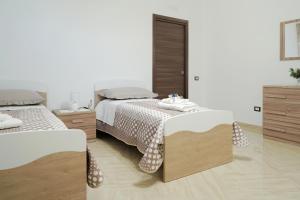 Postel nebo postele na pokoji v ubytování Vesuvius Home