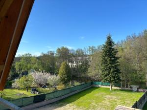 a view of a garden from the roof of a house at Penzion s rafty in Vyšší Brod