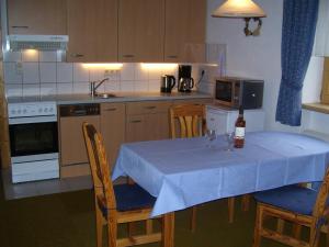 A kitchen or kitchenette at Log Home