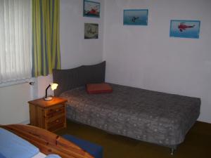 A bed or beds in a room at Log Home