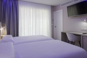 Postel nebo postele na pokoji v ubytování Hotel Jucamar