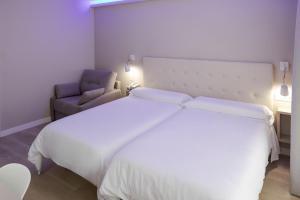 Postel nebo postele na pokoji v ubytování Hotel Jucamar