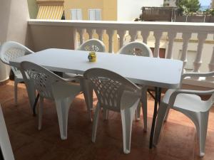 a white table and chairs on a balcony at BRISA de MAR in Moncófar