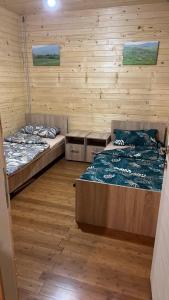 Postel nebo postele na pokoji v ubytování Brvnara kamenjar