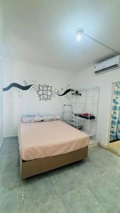 Ліжко або ліжка в номері Kitnet Mobiliada itapua Vila Velha