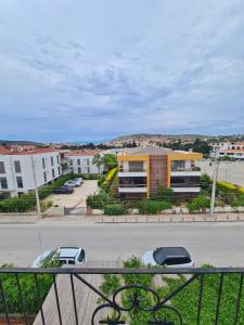 a view of a street with cars parked in a parking lot at Fora Apart Otel Cesme in Çeşme