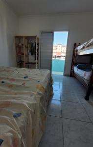 Postel nebo postele na pokoji v ubytování Apto Mongaguá frente p/ praia