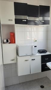 Kuchyň nebo kuchyňský kout v ubytování Apto Mongaguá frente p/ praia + 18 fotografií