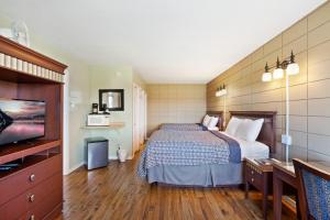 Postel nebo postele na pokoji v ubytování Big Rock Motel