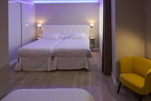 Postel nebo postele na pokoji v ubytování Hotel Jucamar