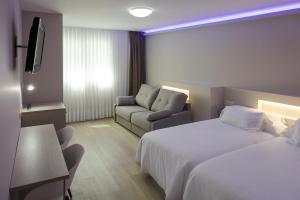 Postel nebo postele na pokoji v ubytování Hotel Jucamar