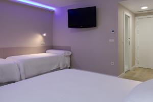 Postel nebo postele na pokoji v ubytování Hotel Jucamar