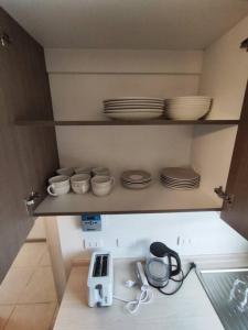 A kitchen or kitchenette at Casa equipada en Condominio