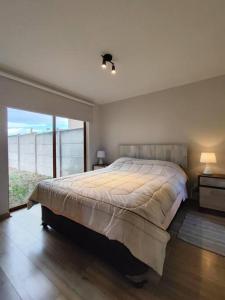 En eller flere senge i et værelse på Casa equipada en Condominio