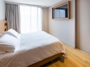 Nodo Hotel客房内的一张或多张床位