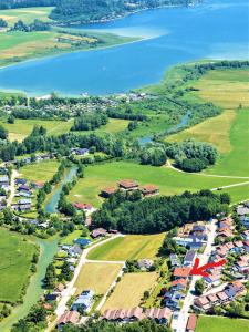 an aerial view of a village next to a lake at Haus am Weinberg in Seekirchen am Wallersee