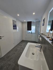 a bathroom with a white sink in a room at Time-Out in Monschau +44 photos
