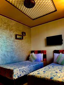 Postel nebo postele na pokoji v ubytování hôtel dar nokhba