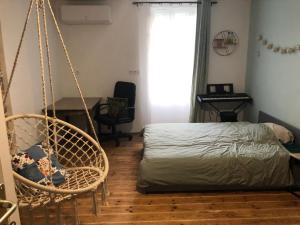 Postel nebo postele na pokoji v ubytování Chambre à l’étage