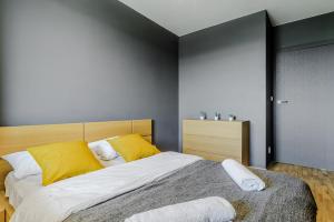 Posteľ alebo postele v izbe v ubytovaní Apartament Ostrobramska - Praga Południe