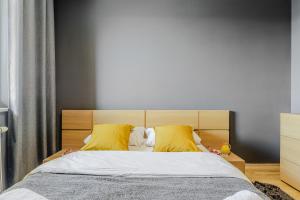 Posteľ alebo postele v izbe v ubytovaní Apartament Ostrobramska - Praga Południe