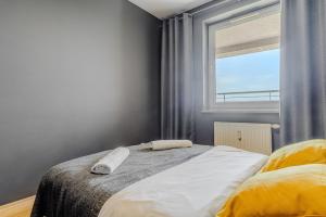 Posteľ alebo postele v izbe v ubytovaní Apartament Ostrobramska - Praga Południe