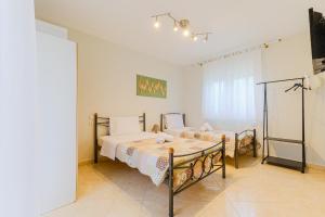 a bedroom with two beds in a room at The Blue House in Leptokarya