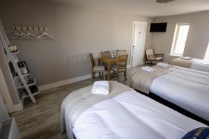 Letto o letti in una camera di Coastal View House