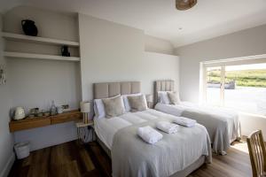 Letto o letti in una camera di Coastal View House