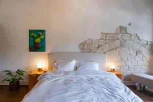 Postel nebo postele na pokoji v ubytování Mila - Boutique Hotel + 71 fotografií