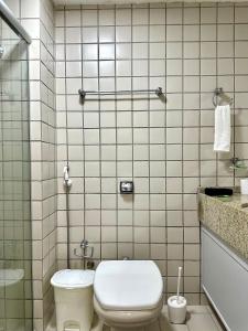 a small bathroom with a toilet and a sink at (108) Studio moderno - Perto da Praia in São Luís