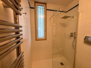 a bathroom with a shower and a glass shower stall at Dadu 150 in Bari +14 photos