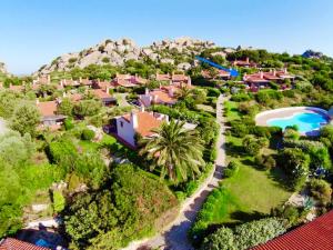 an aerial view of a resort with a pool at Cottage Sardinia by KlabHouse in Palau