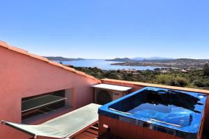 a hot tub on the roof of a house at Cottage Sardinia by KlabHouse in Palau